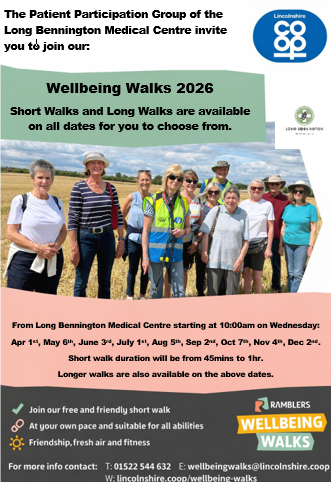 Group of people walking in a field on a wellbeing walk